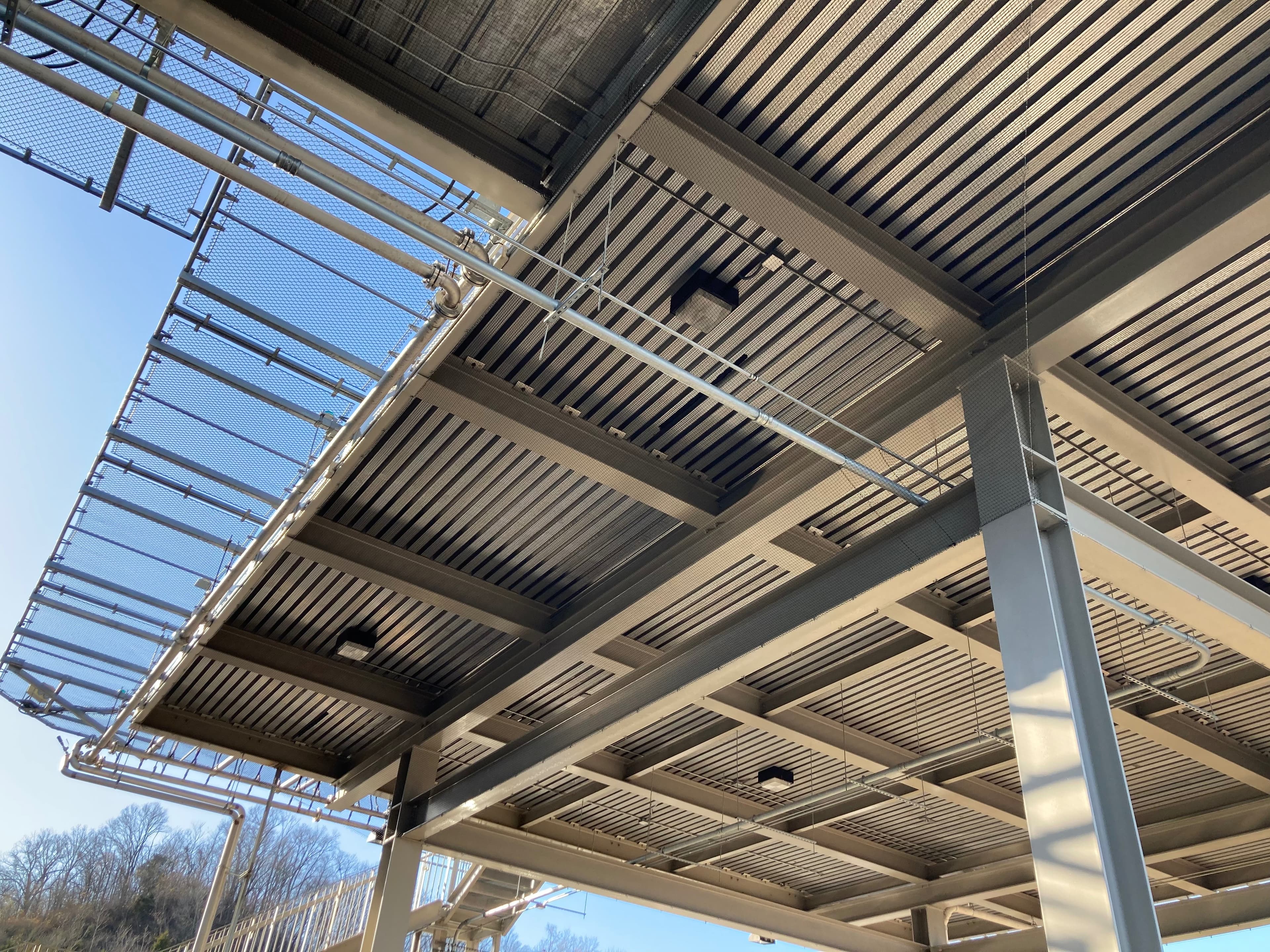 Industrial structure with installed bird netting framework