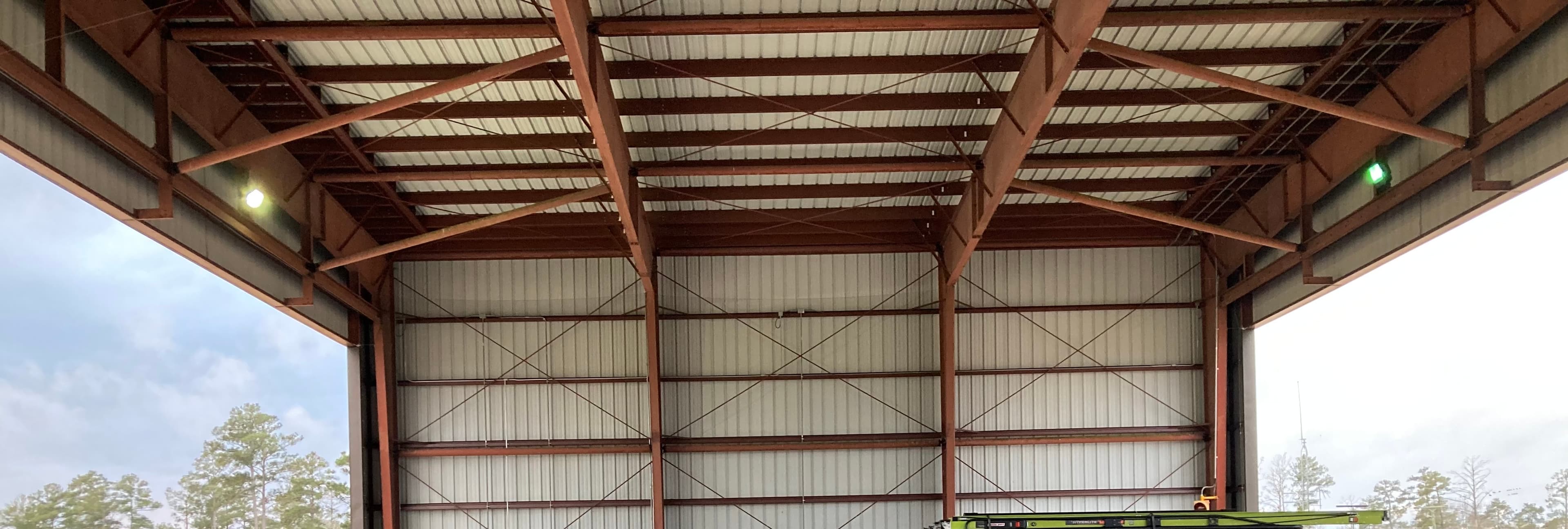 Industrial facility with metal structure and bird netting system