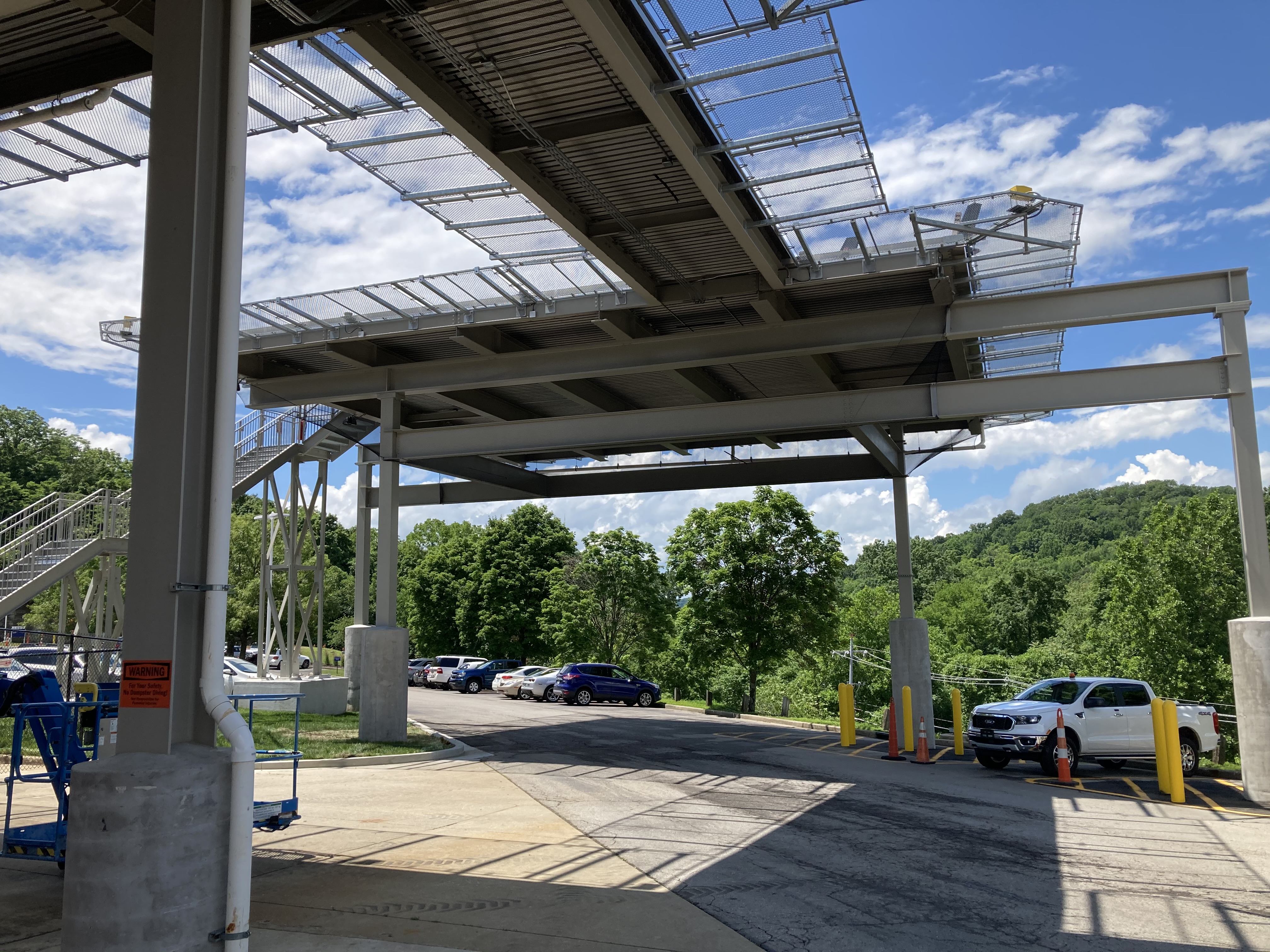 Parking structure with protective bird netting